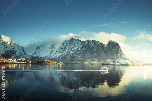 fishing boat and Reine Village, Lofoten Islands, Norway © Iakov Kalinin