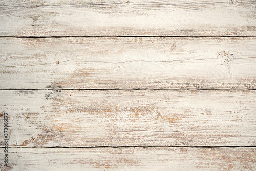 White brown painted weather washed vertical wood texture background. Top view surface of the table to shoot flat lay.Copy space or space for your product. Wooden panel with beautiful patterns. Flat.