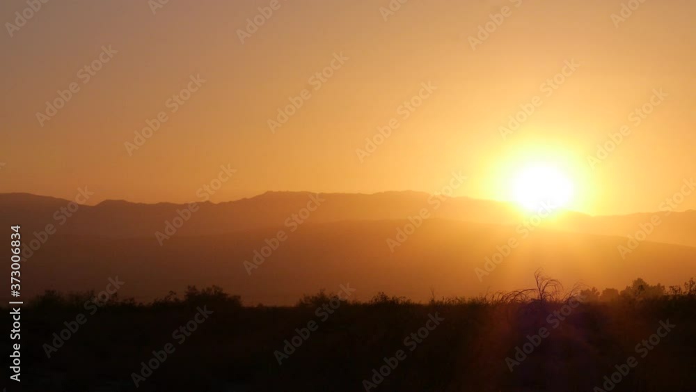 Pan right WS Sunrise in Palm Springs, CA with windy tree Pan right WS Sunrise in Palm Springs, CA with windy tree