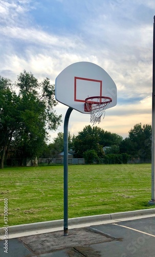 Basketball Hoop in a parking lot of an elementary school