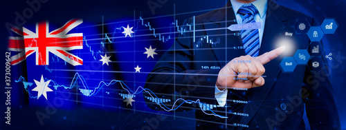 Businessman touching data analytics process system with KPI financial charts, dashboard of stock and marketing on virtual interface. With Australia flag in background. © TexBr