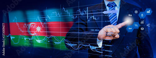 Businessman touching data analytics process system with KPI financial charts, dashboard of stock and marketing on virtual interface. With Azerbaijan flag in background. © TexBr