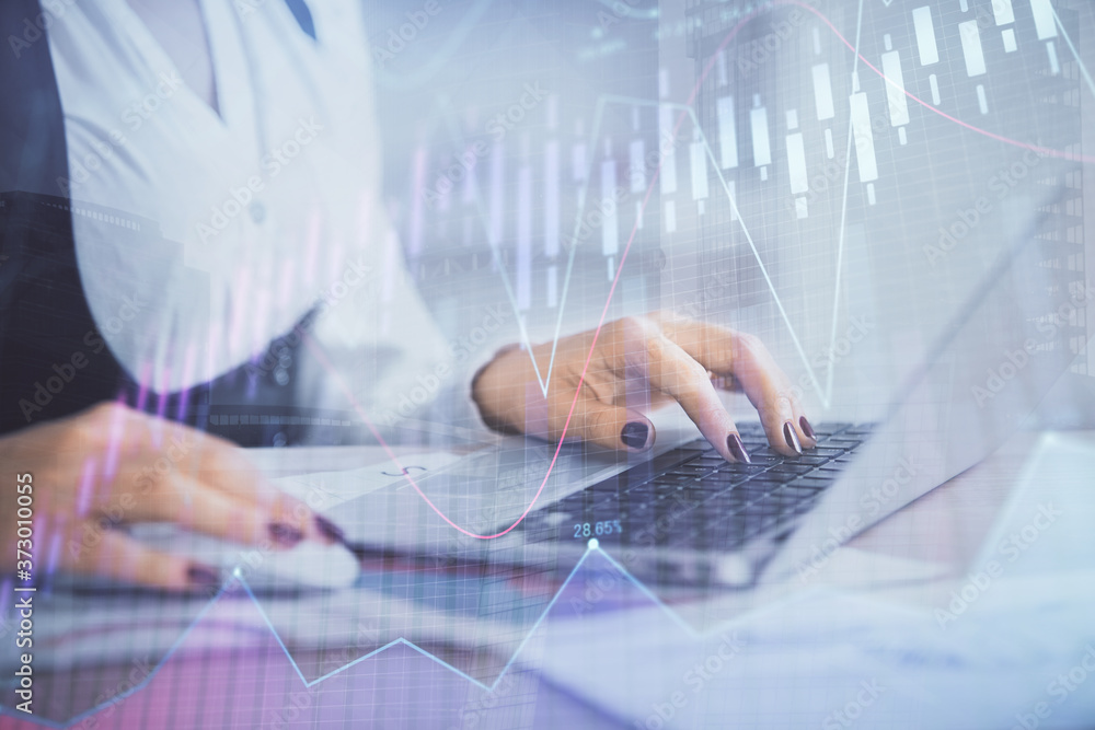 Double exposure of businesswoman hands typing on computer and forex graph hologram drawing. Financial analysis concept. Double exposure of businesswoman hands typing on computer and forex graph hologram drawing. Financial analysis concept.