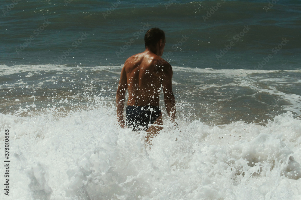 boy running on the beach