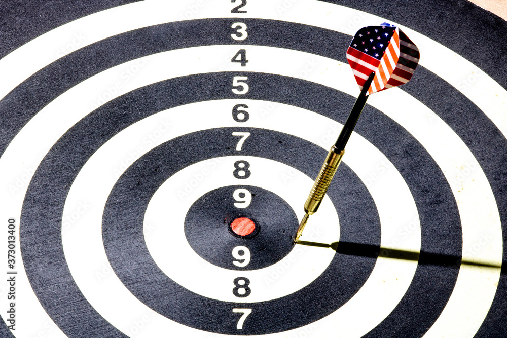 Dart with American USA flag board with darts in aim, with selective focus Dart with American USA flag board with darts in aim, with selective focus