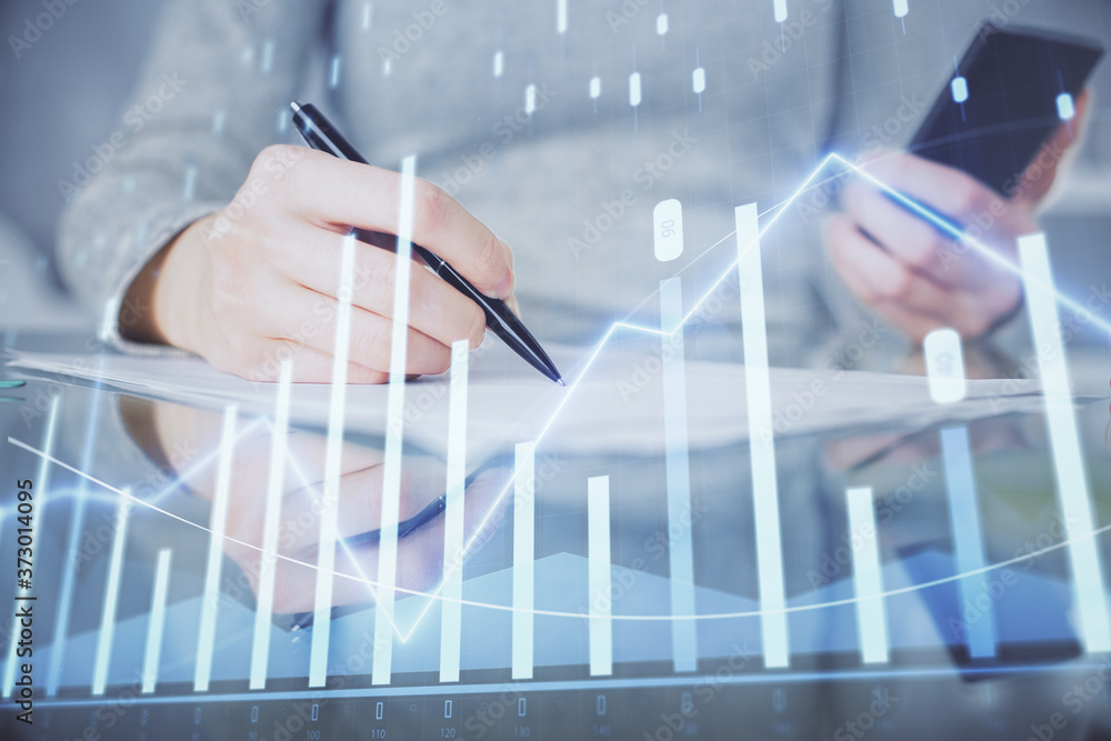 Double exposure of forex chart sketch hologram and woman holding and using a mobile device. Financial market concept. Double exposure of forex chart sketch hologram and woman holding and using a mobile device. Financial market concept.
