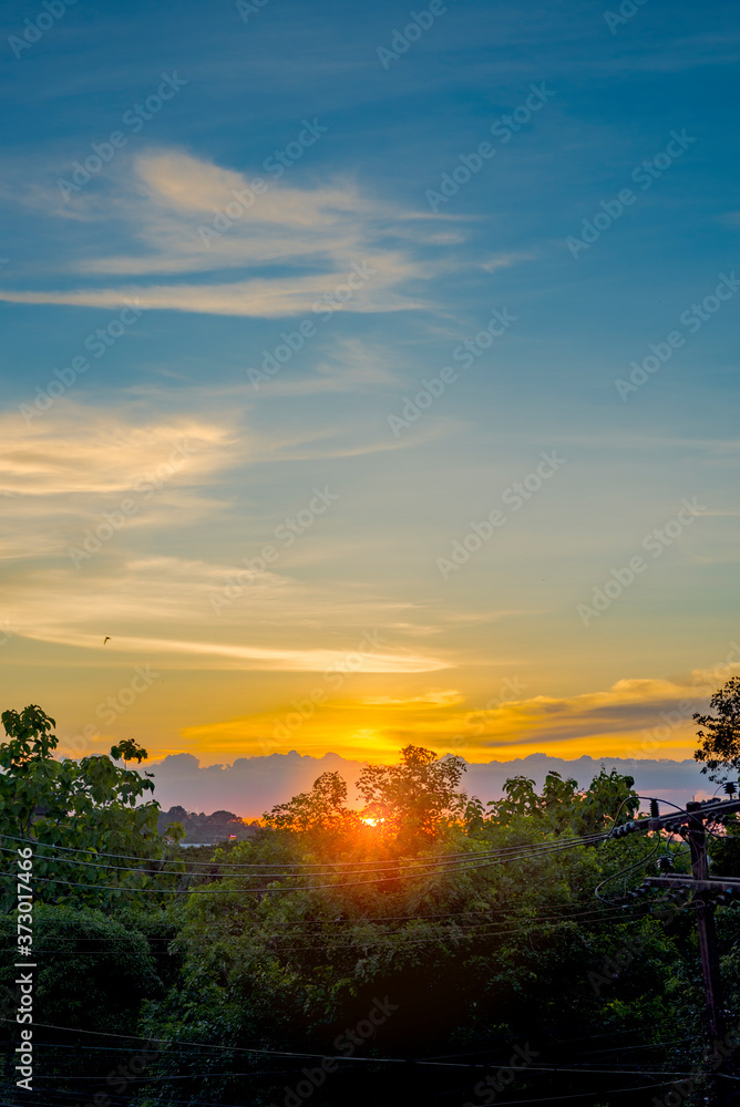 Beautiful sunrise and romantic clouds on the sky Portrait size