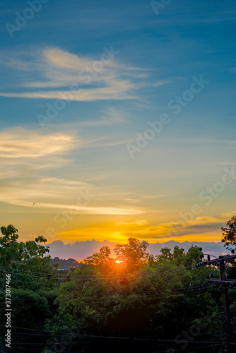 Beautiful sunrise and romantic clouds on the sky Portrait size