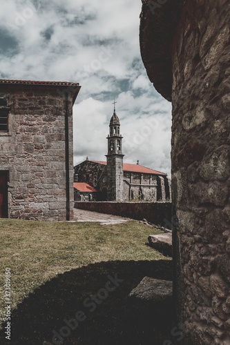 Vertical shot of the Moraime monastery in costa da morte in Spain photo