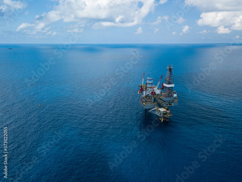 Aerial view from a drone of an offshore jack up rig at the offshore location during day time