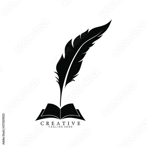 Black Feather Pen above an Open Book