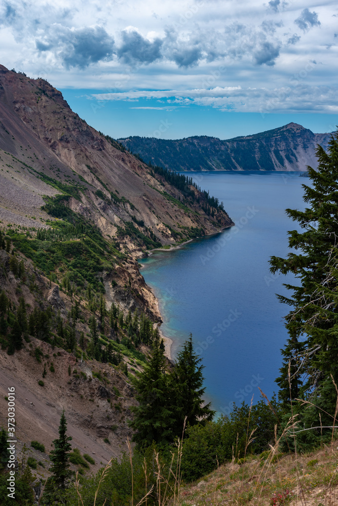 A breath taking view of a steep majestic shoreline of Crater Lake