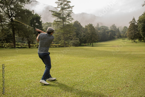 A person playing golf.