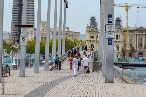 BARCELONA, SPAIN - Jul 28, 2020: People walking through empty streets after COVID 19 in Barcelona photo