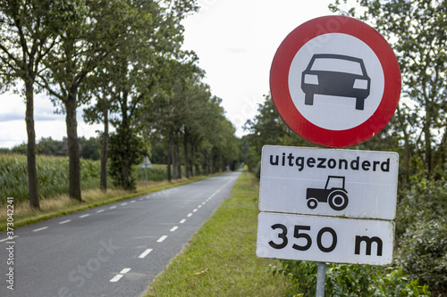 HOGE HEXEL, NETHERLANDS - Aug 01, 2020: Dutch traffic sign on the side of the road photo