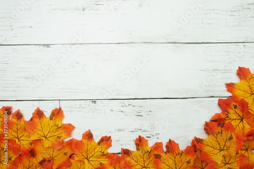 Autumn Maple leave border frame on wooden background