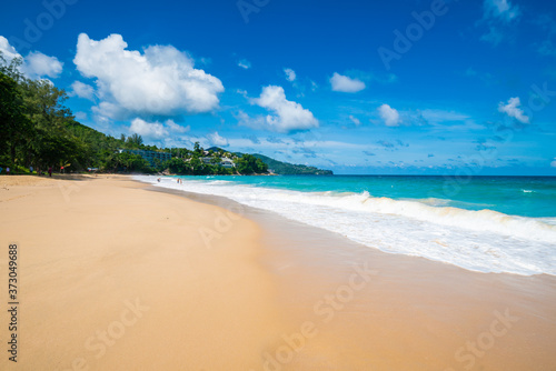 Serenity white snad sea wave beach against blue sky with cloud