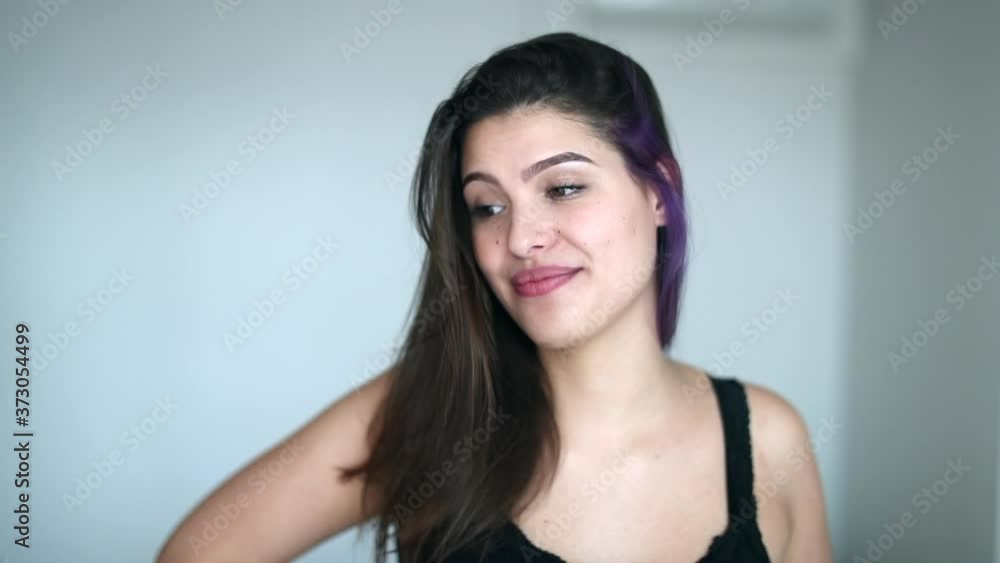 Attractive young woman in 20s in conversation. Pretty girl talking casually Attractive young woman in 20s in conversation. Pretty girl talking casually