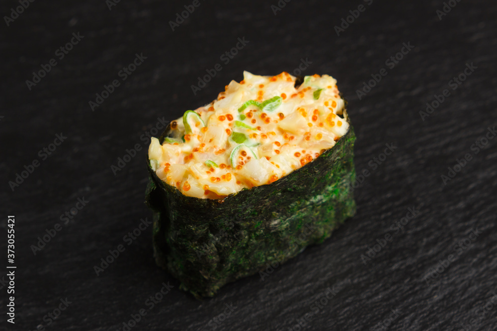 Japanese food: Set of salmon sushi and rolls with salmon and eel Japanese food: Set of salmon sushi and rolls with salmon and eel