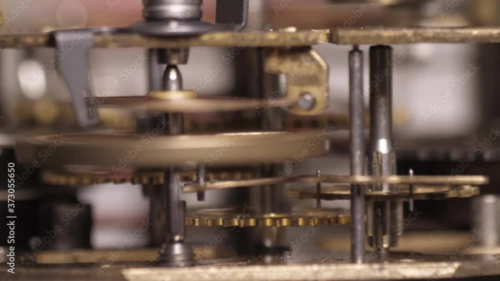 old clock mechanism with metal gears macro shot old clock mechanism with metal gears macro shot