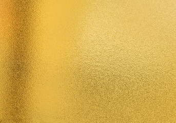 Gold texture background with yellow luxury shiny shine glitter sparkle of bright light reflection on golden surface, for celebration backdrop,