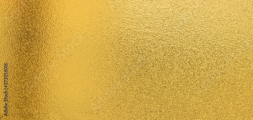 Gold texture background with yellow luxury shiny shine glitter sparkle of bright light reflection on golden surface, for celebration backdrop,