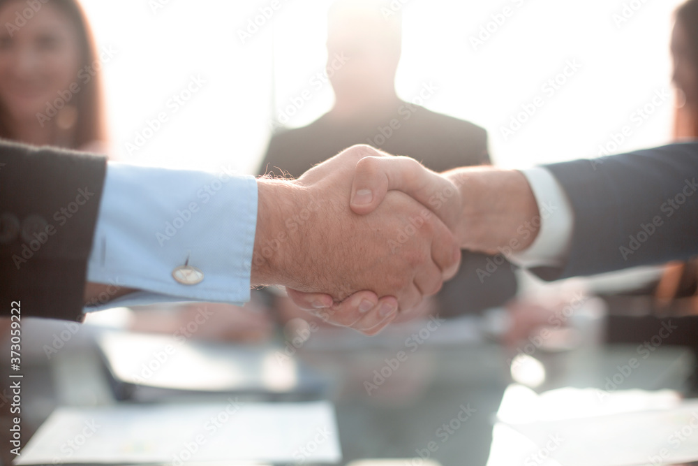 Businessmen shaking hands during a meeting Businessmen shaking hands during a meeting