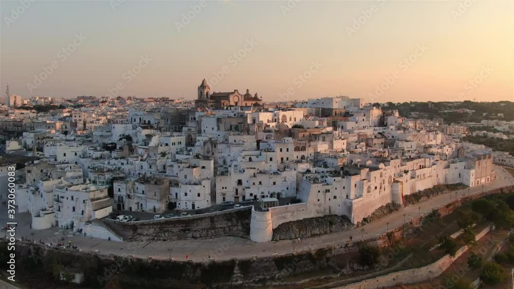ostuni old city at sunset aerial view drone fly forward apulia italy ostuni old city at sunset aerial view drone fly forward apulia italy