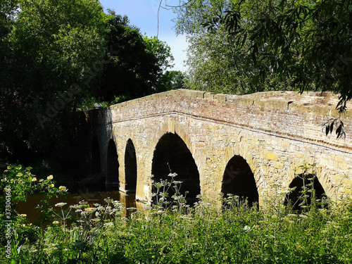 Medieval bridge over river Avon. Pershore Worcestershire England UK photo