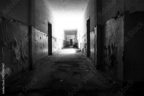 Dark corridor, mysterious and dangerous place in black and white