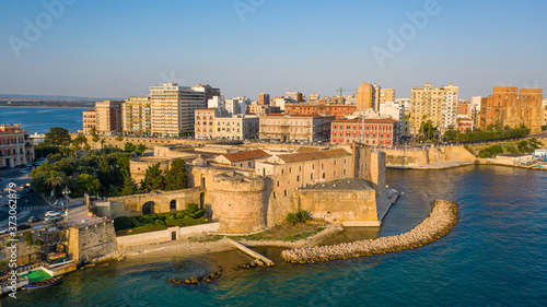 Beautiful panoramic aerial view photo from flying drone on Old medieval Aragonese Castle on sea channel, old town of Taranto city, Puglia (Apulia), Italy (Series)