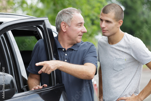 father on car journey with teenage son