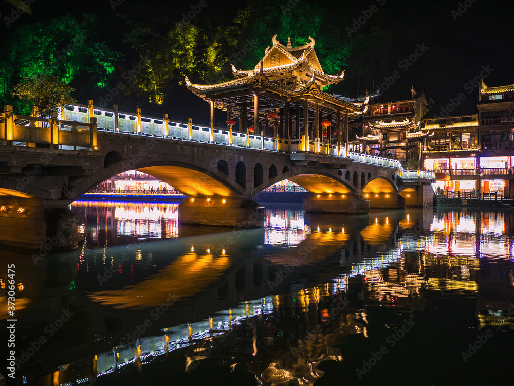 Scenery view of the bridge in the night of fenghuang old town .phoenix ancient town or Fenghuang County is a county of Hunan Province, China