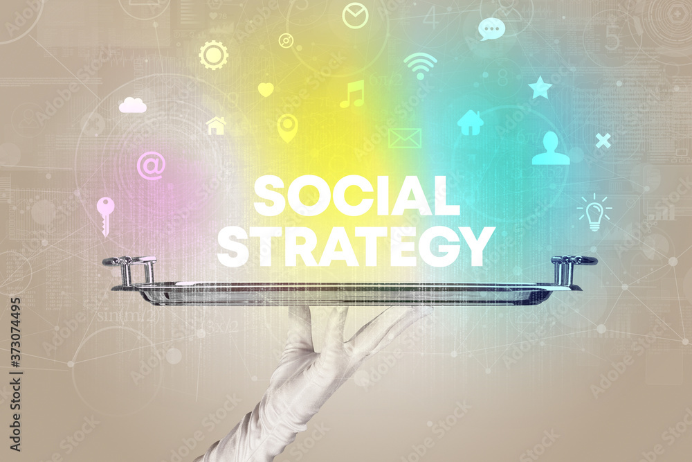 Waiter serving social networking with SOCIAL STRATEGY inscription, new media concept Waiter serving social networking with SOCIAL STRATEGY inscription, new media concept