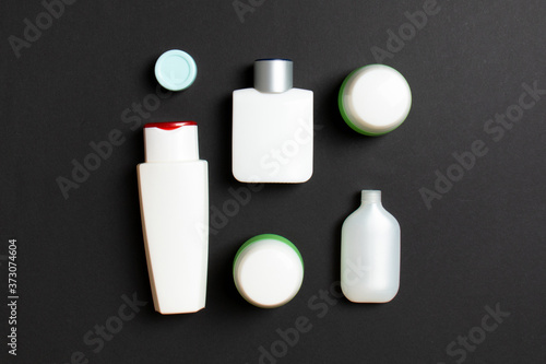 Wallpaper Mural Cosmetics SPA branding mock-up, top view with copy space. set of tubes and jars of cream flat lay on colored background Torontodigital.ca