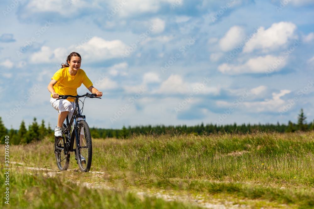 Girl biking against cloudy sky
Girl biking against cloudy sky