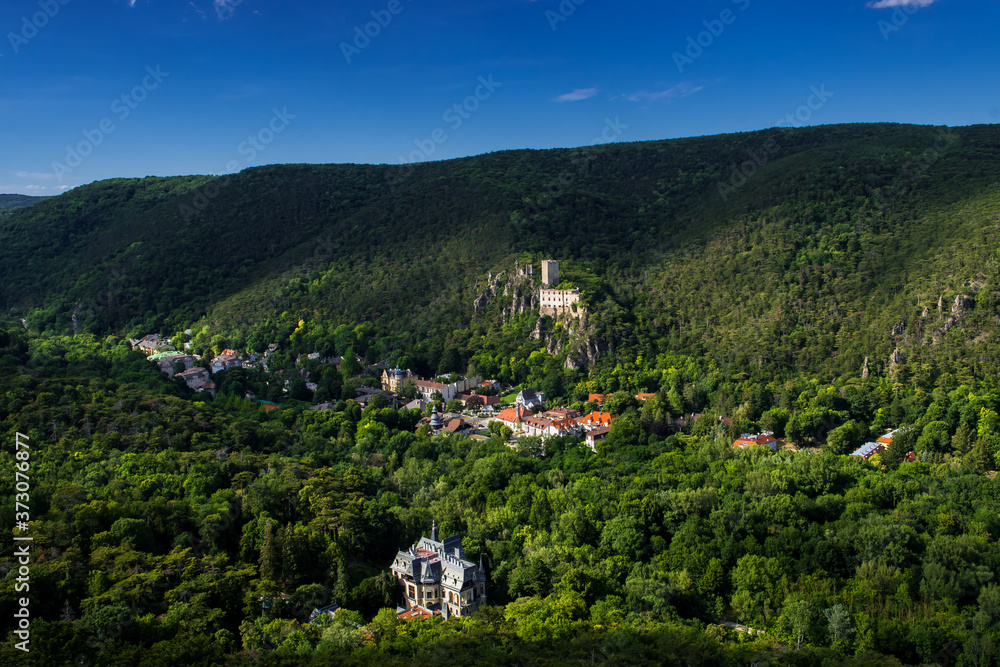 Fototapeta premium Green Valley Helenental With Remote Settlement, Castle Ruins And Villas At Baden Near Vienna In Austria