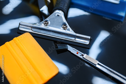 Tools for car tinting closeup, vehicle tuning