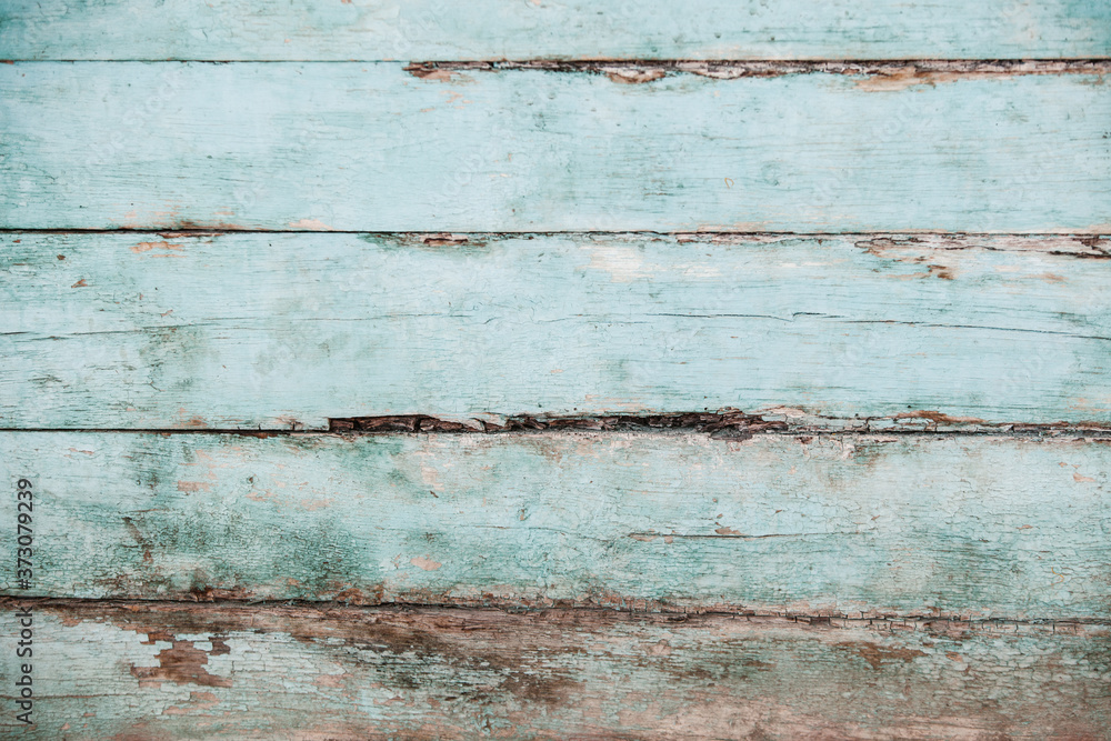 Obraz premium Vintage blue wood background texture with knots and nail holes. Old painted wood wall. Blue abstract background. Vintage wooden dark horizontal boards. Front view with copy space