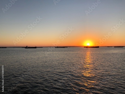 beautiful panoramic view of the sun rising over the strait © sendayalor
