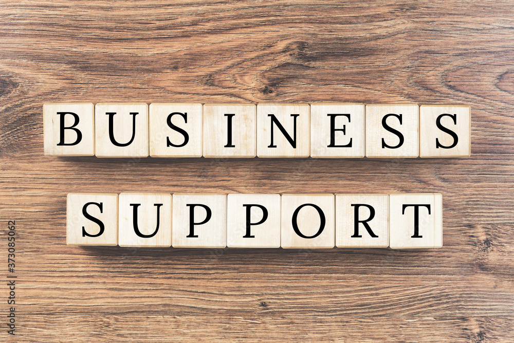 Business support text on wooden background. Local business or expert advise and support concept.