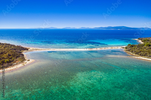 Amazing exotic islands with natural bridge in turquoise sea on the island of Dugi Otok on Adriatic sea in Croatia, drone aerial view