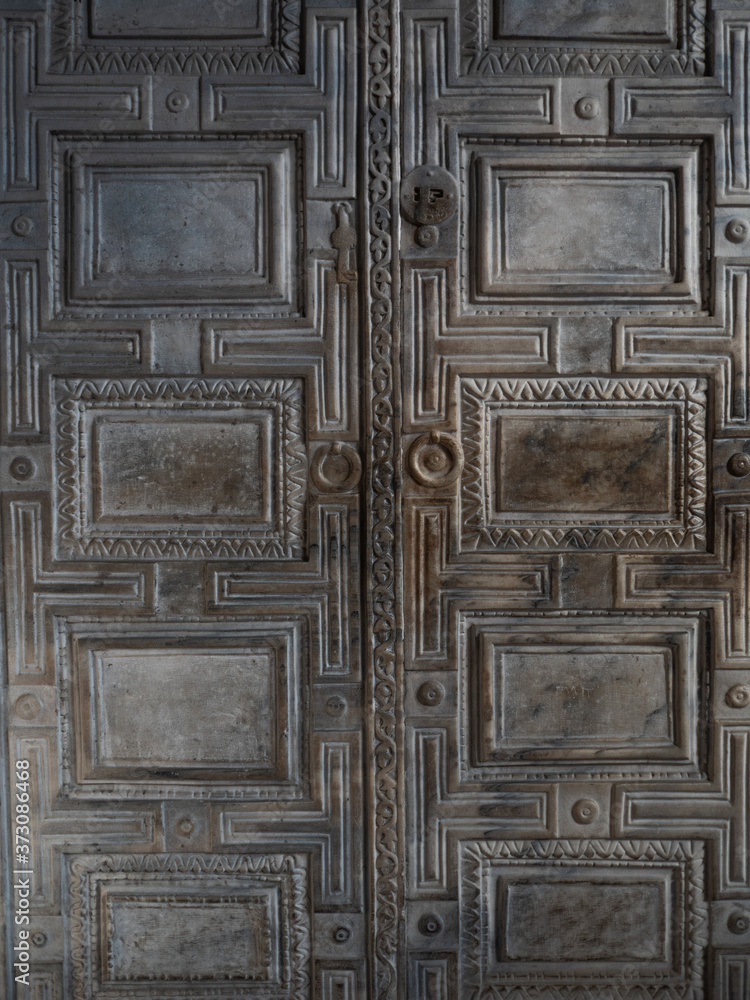 mysterious door. Old texture of the double-leaf entrance mysterious door. Old texture of the double-leaf entrance