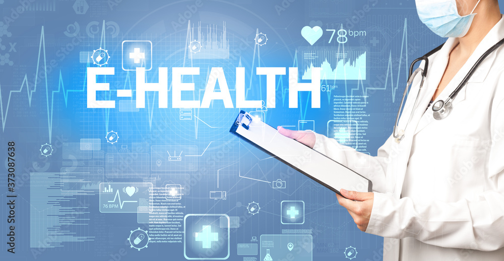 young doctor writing down notes with E-HEALTH inscription, healthcare concept
