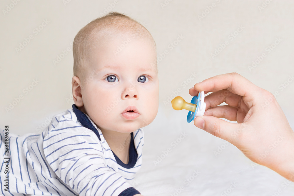 Baby looking at camera with serious facial expression Baby looking at camera with serious facial expression