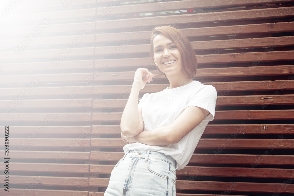 Fototapeta premium Fashion hipster cool girl relaxing on city street