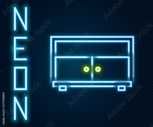 Glowing neon line Chest of drawers icon isolated on black background. Colorful outline concept. Vector Illustration.