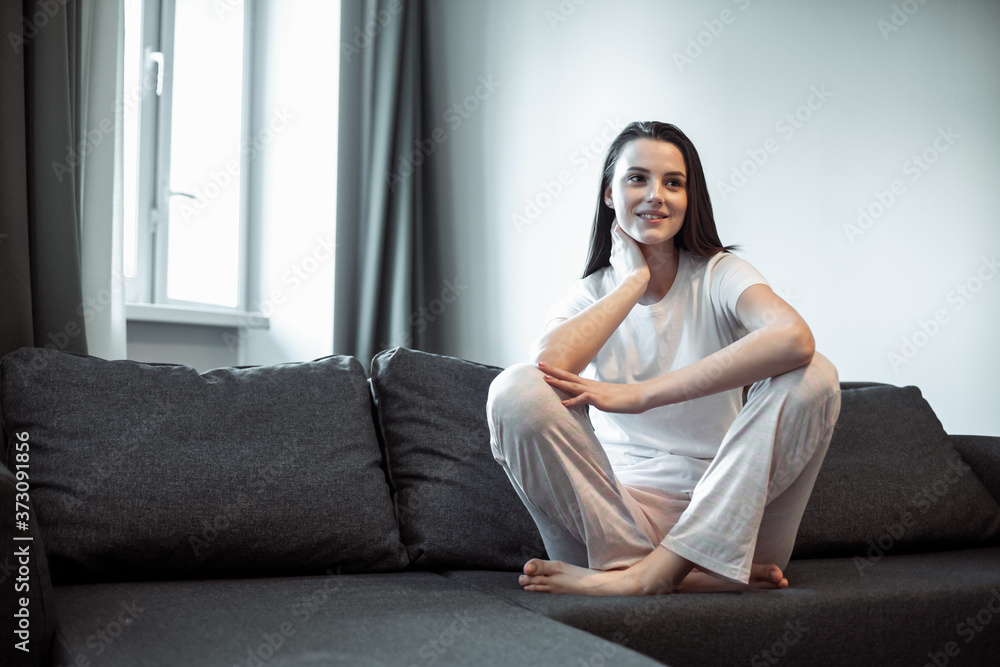 Young woman pretty relaxing on couch in living room Young woman pretty relaxing on couch in living room
