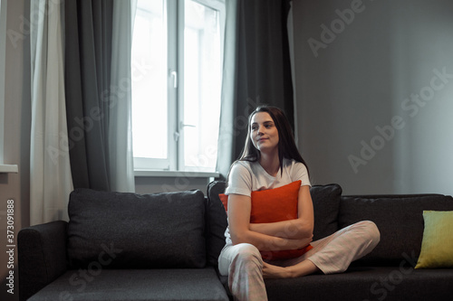 Young woman pretty relaxing on couch in living room