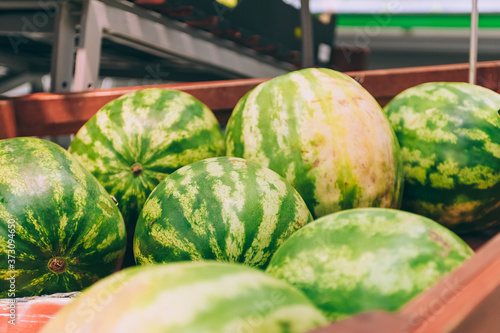 A box of fresh watermelon in a supermarket. photo